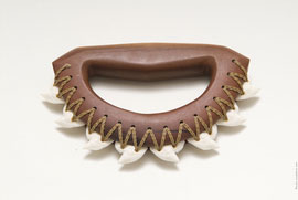 One of Kai's creations—a slashing tool made from kauila wood, cordage, and tiger shark teeth.